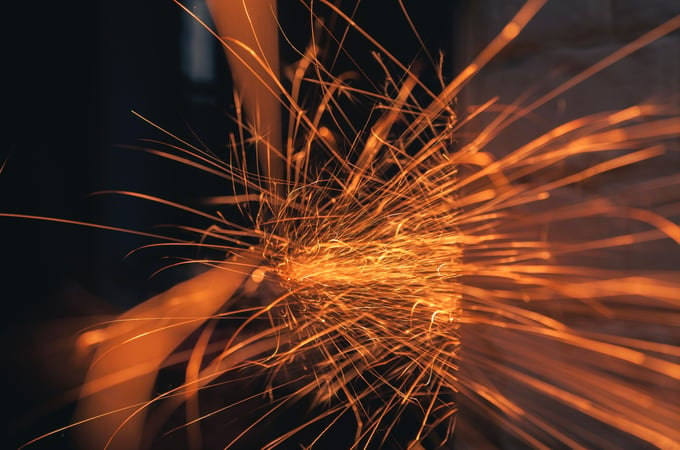 Sparks fly as two wires converge carrying data